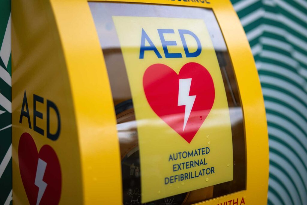 Who benefits from a defibrillator?